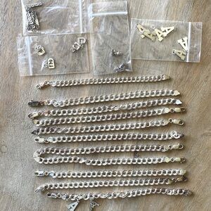 Group of Eleven .925 Sterling Silver Charm Bracelets w random charms